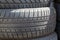 a close up of used car tyres or tires showing the rubber tread