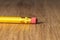Close up of a used single yellow pencil eraser