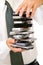 Close-up of usinessman holding stack of phones