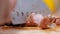 Close-up using a knife sliced Roast pork on the cutting board in the kitchen