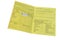 Close-up vaccination sticker in yellow blank emergency ID card of a patient in Germany, immune passport in German, immunization