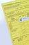 Close-up vaccination sticker in yellow blank emergency ID card of a patient in Germany, immune passport in German, immunization