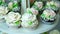 close-up, a variety of delicious desserts, cupcakes, cream cakes, whipped cream, flowers made with cream. festive decor