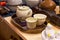 Close-up of various Chinese tea sets on shelves