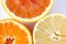 Close up of various citrus fruits - Myers lemon, mandarin and orange