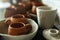 A close-up of various drying clay tableware on a shelf. A pottery studio concept. Craftmade dishes, bowls, pots, mugs of