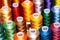 close-up of various sized spools of thread