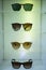 Close-up of various sunglasses on display