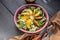 Close-up vegan salad with romano leaves and fried peach. Horizontal shot