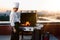 Close-up: vegetables and meat filet mignon on a barbecue grill on the rooftop of a skyscraper. Fire in the barbecue