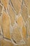 Close up on vertical beige texture stone background wall