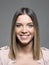 Close up vertical portrait of young beauty with straight ombre hairstyle smiling and looking at camera