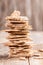 Close-up vertical stack  of corn crispbreads on wooden background.