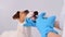 Close-up of a veterinarian injecting medicine from a syringe into a dog's mouth on a white background. Jack russell