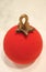 Close Up of Vibrant Red Velvet Christmas Ball Ornament Shaped Cake with Berry Mousse Inside