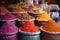 close-up of vibrant spice piles in a market