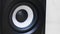 Close-up of vibrating bass speaker. Concept. Black speaker vibrates when bass is loud. Loud and clear sound from PC