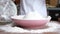 Close-up video of a child`s hands sifting flour through a sieve, hands in flour, home style frames