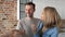 Close up video of couple receives the keys to a new apartment.