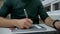 Close up video of a graphic designer sketching on the tablet, working in the office. The man uses a smart watch and uses the