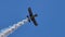 Close up view in 4K of a small retro propeller airplane doing aerobatic