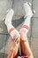 Close up view from above of woman`s legs in a vintage roller skates, golfs.