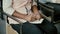 Close-up view of african female hands. Woman sitting on a chair and writing in notebook. Student girl at a lecture.