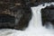 Close up view of Aldeyjarfoss waterfall and basalt formations ar