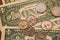 Close up view of American dollar bills and coins as background. Heap of American dollars for design.