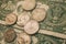 Close up view of American dollar bills and coins as background. Heap of American dollars for design.