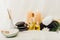 close up view of arrangement of spa treatment accessories with towels, pebbles and essential oil