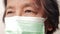 Close-up view of Asian elderly woman`s face Wear a mask to prevent coronavirus Covid-19.