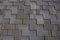 Close up view on Asphalt Roofing Shingles Background. Roof Shingles - Roofing.