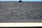 Close up view on Asphalt Roofing Shingles Background. Roof Shingles - Roofing. Bitumen tile roof