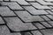 Close up view on Asphalt Roofing Shingles Background. Roof Shingles - Roofing. Roof shingles covered with frost