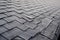 Close up view on Asphalt Roofing Shingles Background. Roof Shingles - Roofing. Shingles roof damage covered with frost.