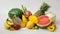 Close up view of assortment of exotic fruits and copy space on white background