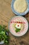 Close up view on Baba ghanoush - Levantine appetizer of mashed cooked eggplant mixed with tahini with yogurt sauce in a ceramic