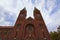 Close-up view of Basilica of Our Mother of Mercy against blue sky. Franciscan church with monastery