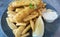 Close-up view of battered fish and chips fries