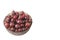 Close up view of bawl with ripe red gooseberries on white background isolated.