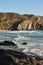 Close up view of the beach and rocks washed by the ocean waves. Atlantic Ocean, Portugal