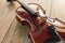 Close up view of beautiful classical violin lying on wooden background. Music background