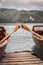 Close up view on beautiful wooden flat rowing boats with oars on lake bled, slovenia, go green concept