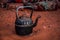 Close up view of a berber teapot on the Sahara`s sand