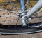 Close up view at a bicycle wheel with metal spokes