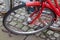 Close up view at a bicycle wheel with metal spokes