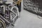 Close up view of bicycles covered with snow and snowy wall.