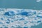 Close up view of blue ice burg floting in the blue aqua lake at Perito Moreno glacier in Los Glaciares National Park, Santa Cruz,
