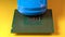 Close up view of a blue toy car on top of a microprocessor.